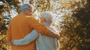 Couple walk arm in arm