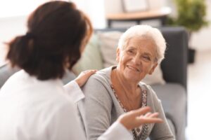 Older woman speaks visits with her orthopedic physician